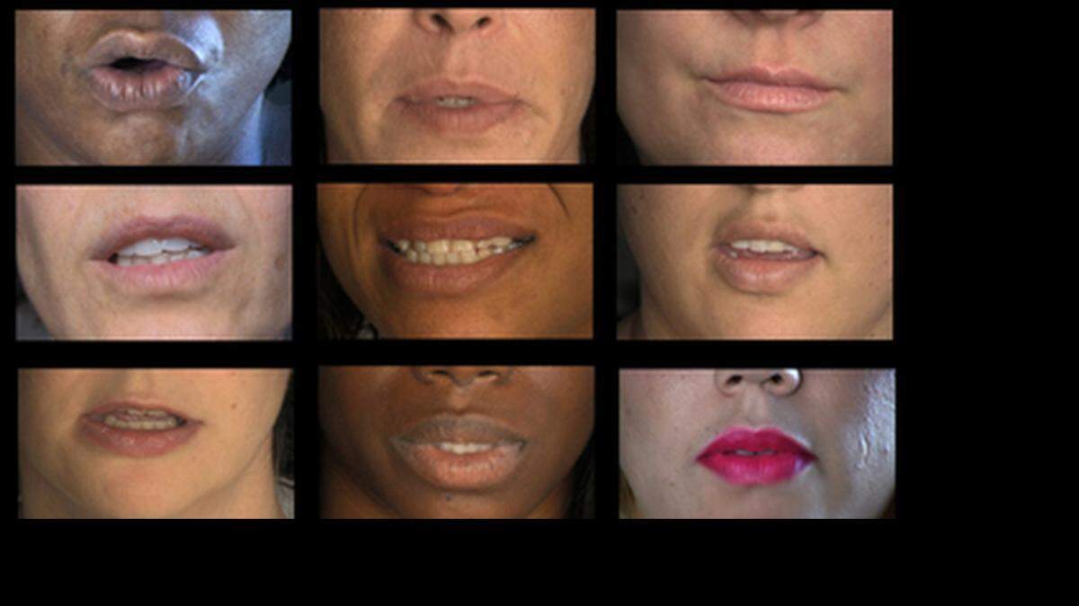 
WALL OF SOUND: Monitors featured the mouths of women telling their stories of domestic abuse.

