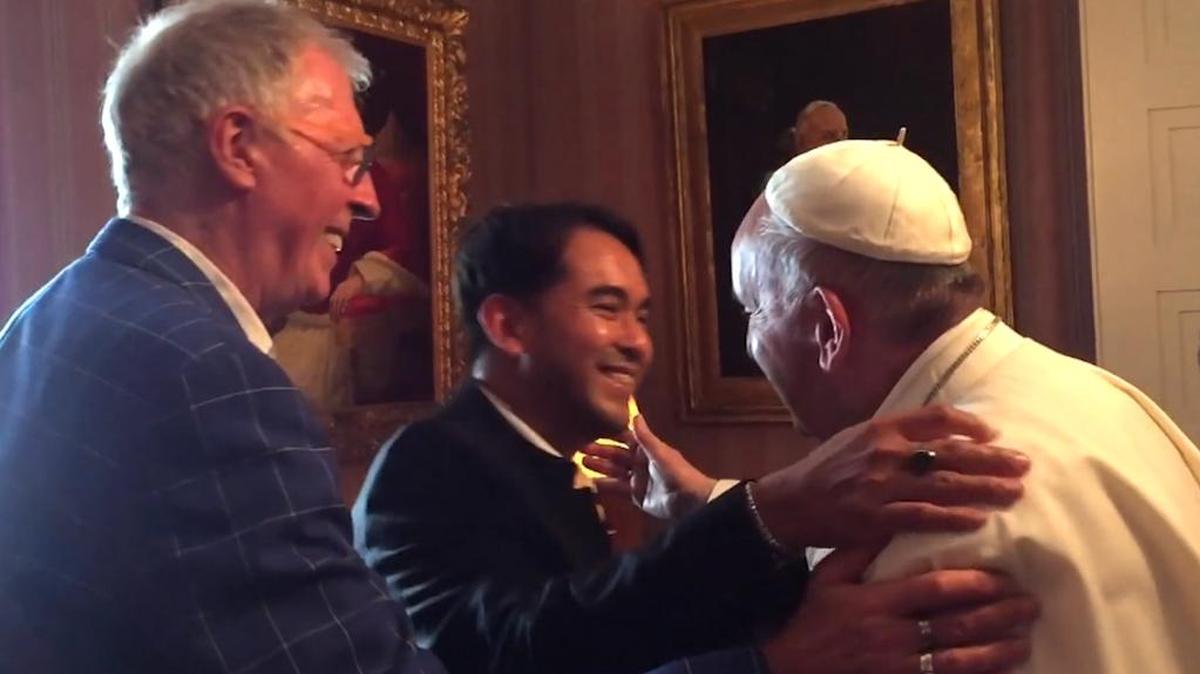 Pope Francis meets with his former student, Yayo Grassi, left, and his partner, Iwan Bagus.