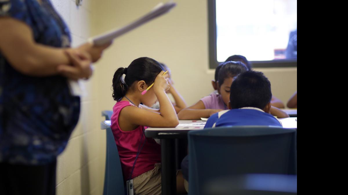 
IN DETENTION: Elementary-aged children take a class in Spanish at a federal immigration detention center in Karnes City, Texas. 
