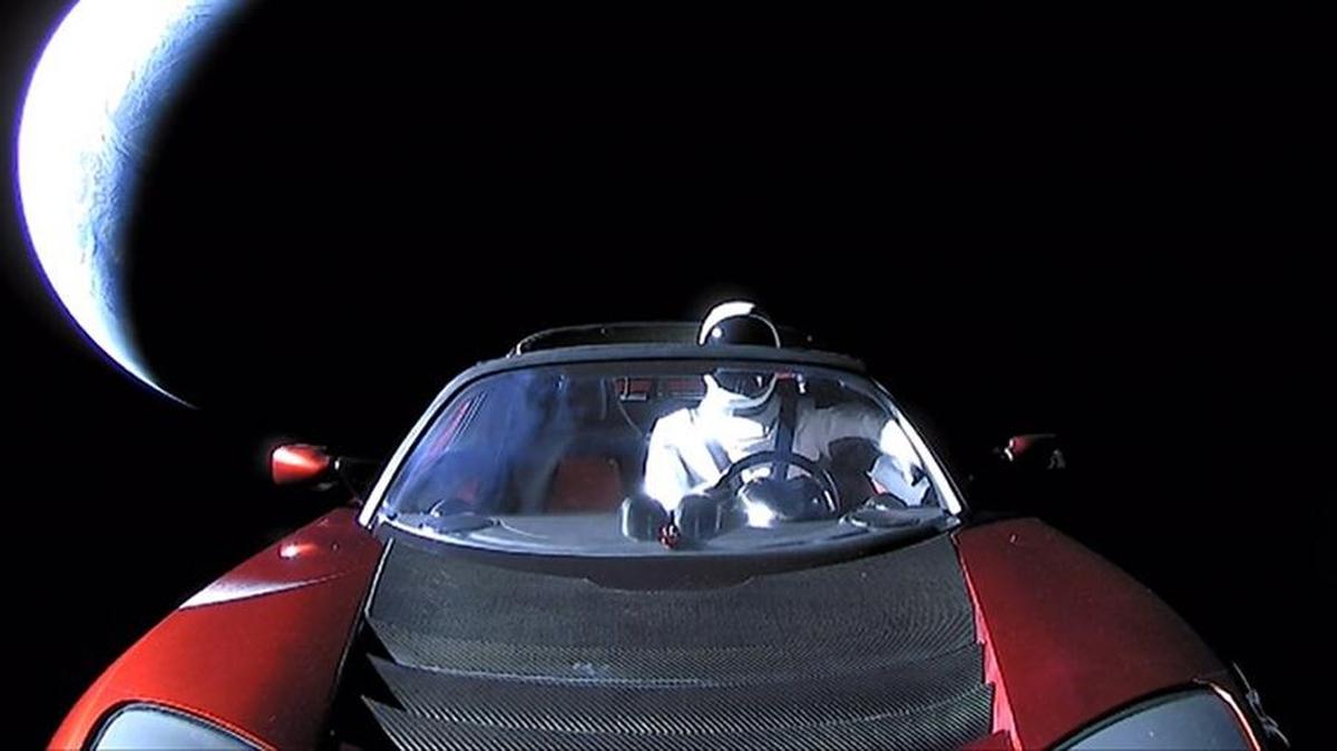 Elon Musk posted a photo of the red Tesla sports car headed into deep space, “driven” by Starman.
