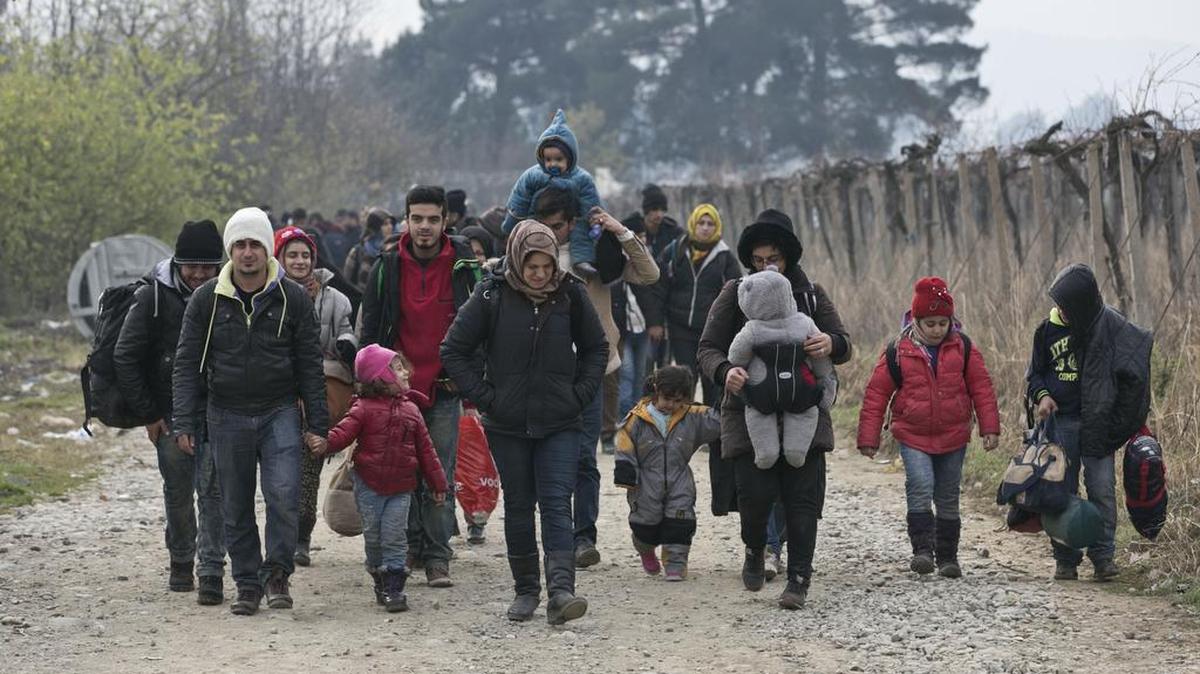 Religious leaders say refugees like these crossing the Balkans should be seen as persons, not problems.