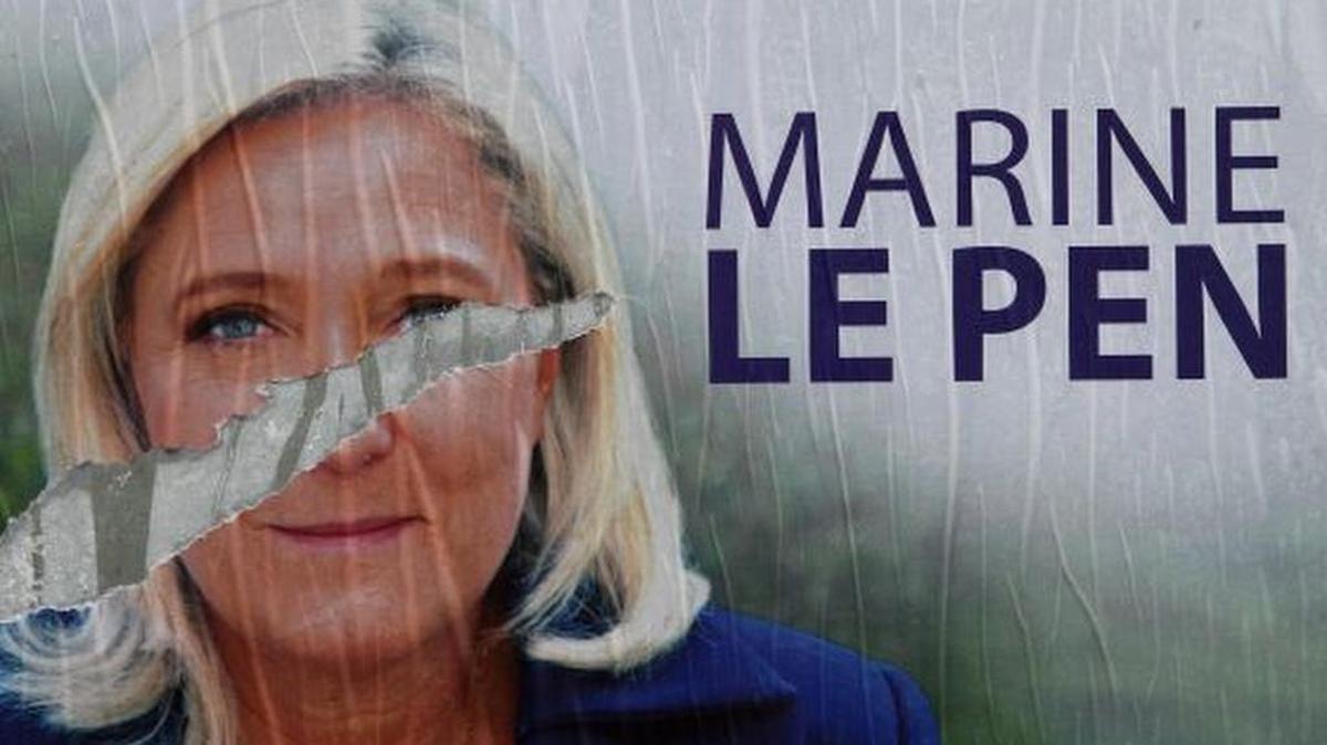 French conservative Marine Le Pen is a divisive figure, as the ripped poster of her image attests.