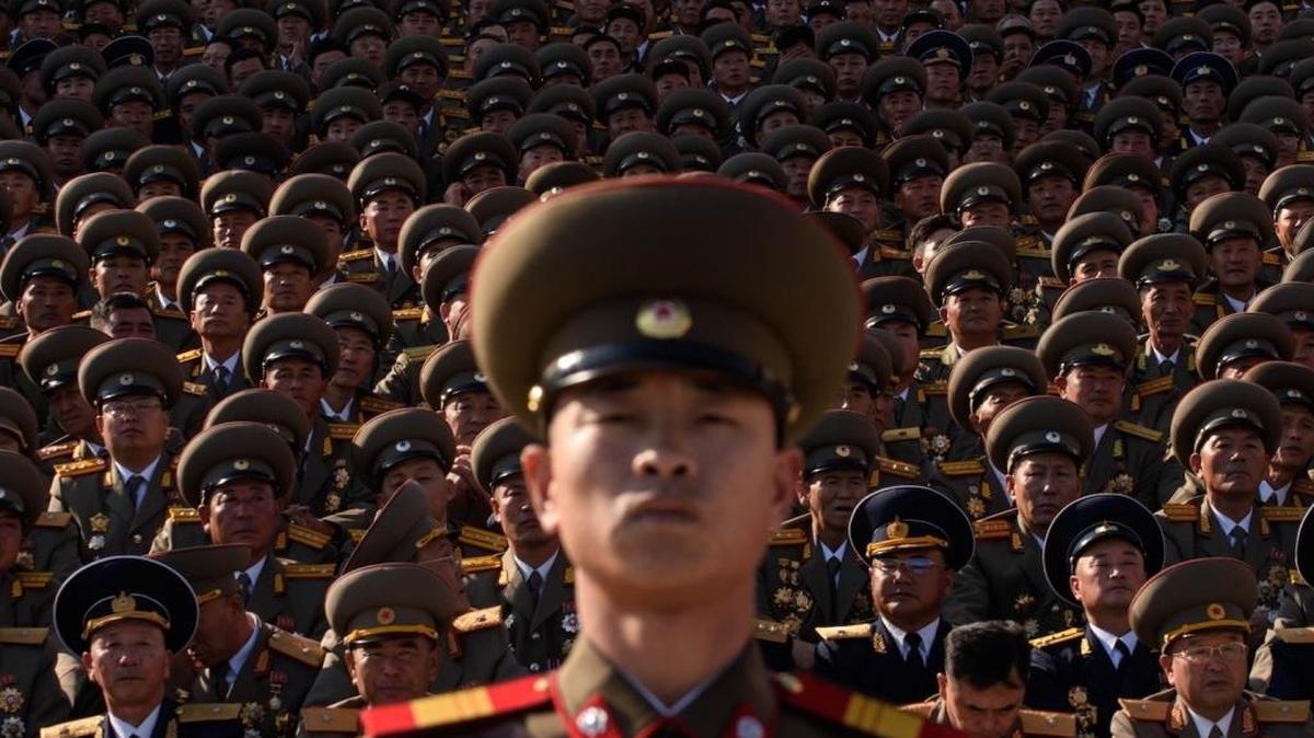 A North Korean soldier stands before spectators during a mass military parade in 2015 in Pyongyang.