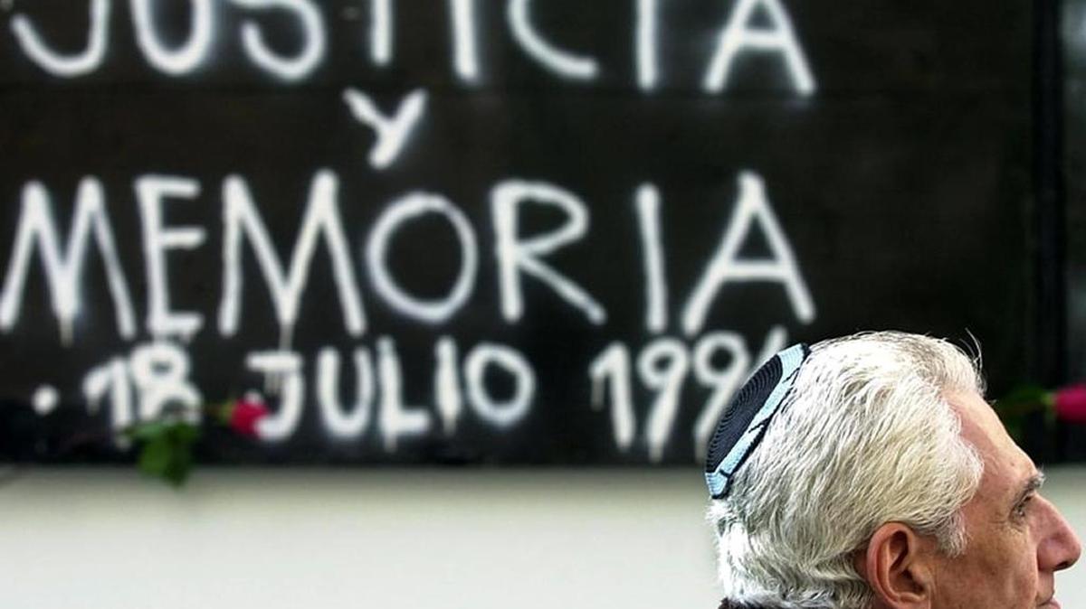 A man visits the site of the 1994 AMIA bombing on the seventh anniversary of the attack in Buenos Aires, in which 85 people were killed.