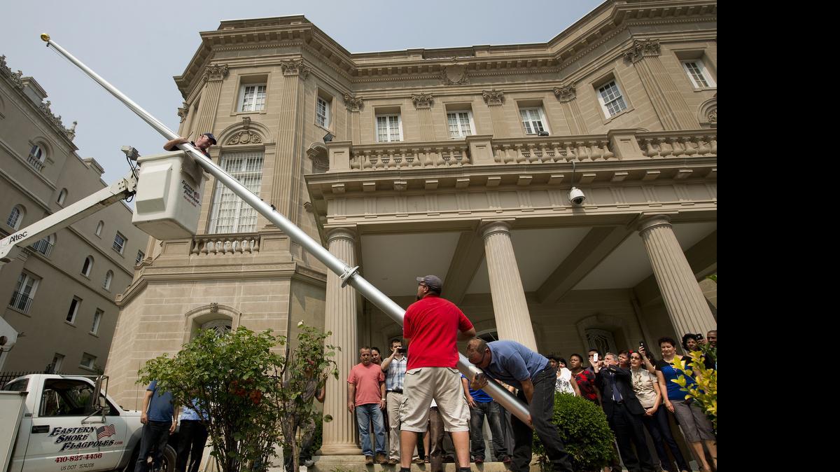 
NORMALIZATION: Workers raise a flagpole at the Cuban Interests Section in Washington last week in preparation for re-opening of embassies in Havana and Washington. 
