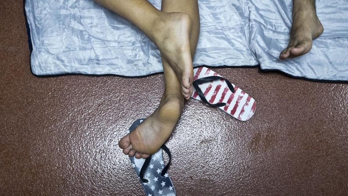 The flip-flops of a Cuban migrant stuck in Costa Rica at the Nicaraguan border bear the design of the American flag.