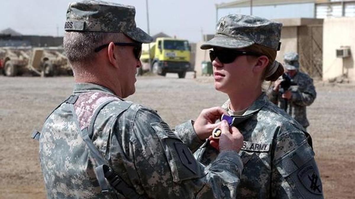 Staff Sgt. Jennifer Hunt, a civil affairs specialist, receives a purple heart. In 2012, she was one of several servicewomen who challenged the Pentagon's policy excluding women from combat positions.