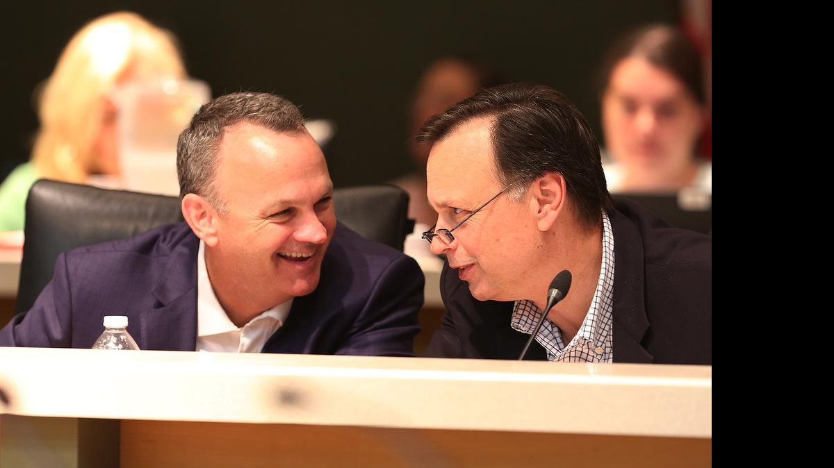 
BUDGET DEAL: House appropriations chairman Rep. Richard Cocoran, left, and Sen. Tom Lee share a laugh in the final days of the Special Session as they worked out a deal on state spending.

