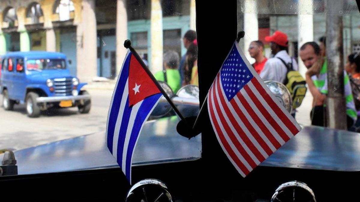 Cuban and American flags displayed together.