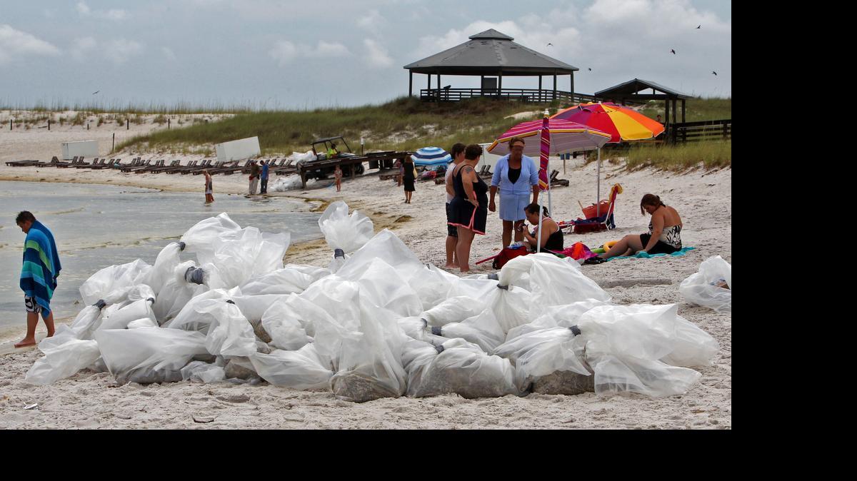 
BP SPILL: Workers cleaned up a beach near Panama City after the 2010 oil spill. Florida has now received nearly $3.25 billion as its share of the multi-state settlement with BP.
