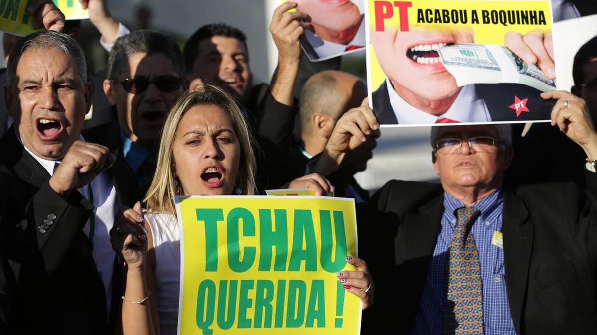 Opposition deputies carrying sings that read in Portuguese “Bye Dear” and “Workers Party, it’s over,” protest in favor of the impeachment of the Brazil's President Dilma Rousseff.