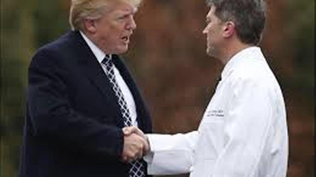 President Trump shakes hands with White House physician Dr. Ronny Jackson after his first medical checkup as president at Walter Reed National Military Medical Center last week.