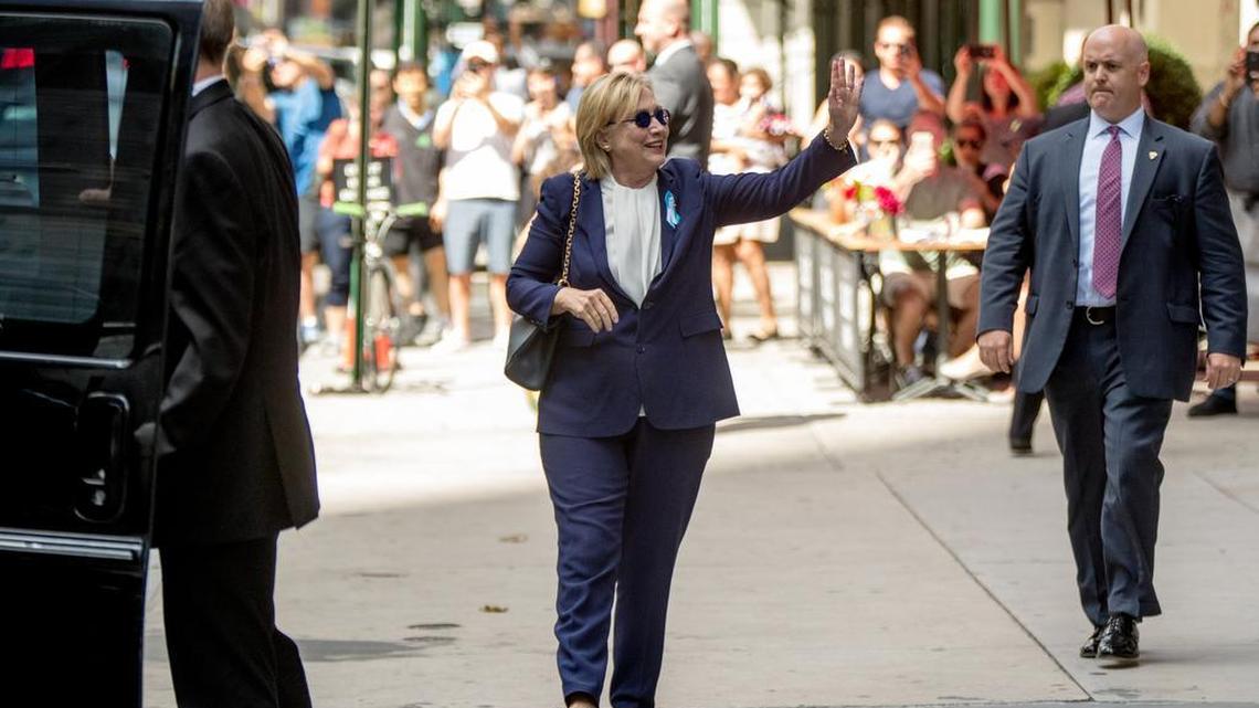 Hillary Clinton leaves an apartment building in New York on Sunday after leaving a 9/11 anniversary ceremony early saying she felt ill.