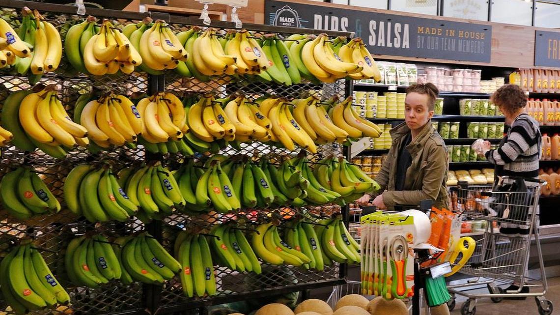 Customers shop at Whole Foods Market for their elite food products. Amazon is moving swiftly to make big changes.