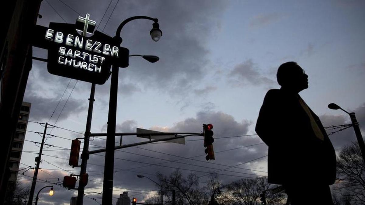 A man walks past Ebenezer Baptist Church, a historic site where Martin Luther King Jr. was baptized, ordained a minister and, finally, eulogized.