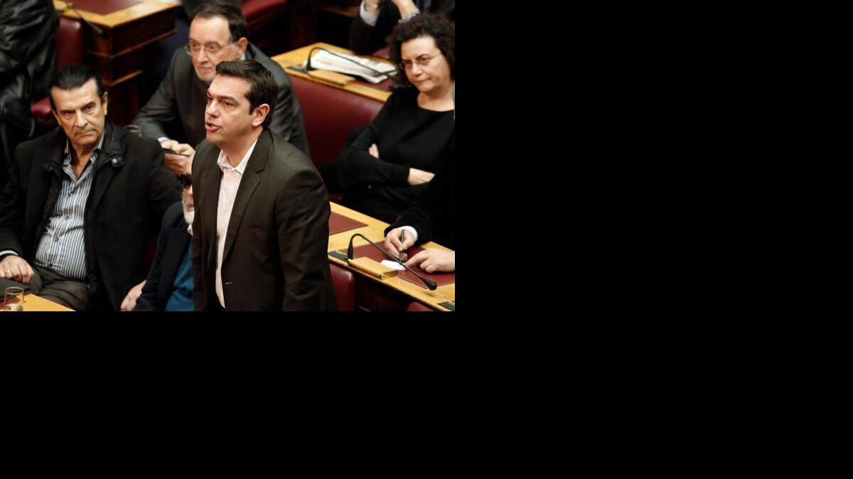 
GREECE: Alexis Tsipras, standing, leads the leftist Syriza Party into elections slated for January.
