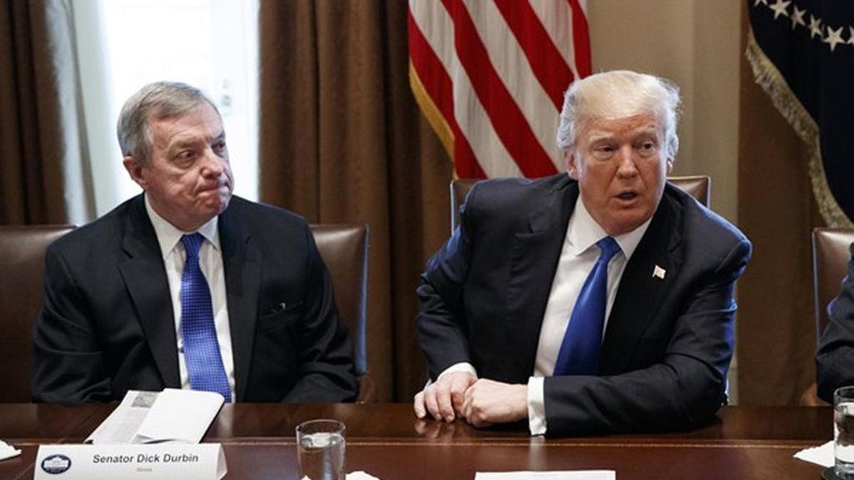 Democratic Sen. Dick Durbin, left, listens to President Trump during a meeting with lawmakers on immigration policy at the White House.