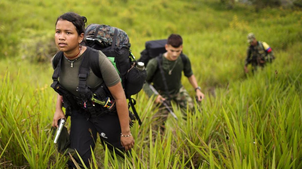 Members of the Colombian guerrilla forces trek to a new camp in Antioquia state in the northwest Andes in January.