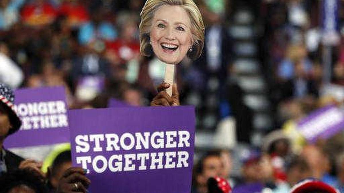 Delegates hold up signs in support of Hillary Clinton during the Democratic National Convention in July.