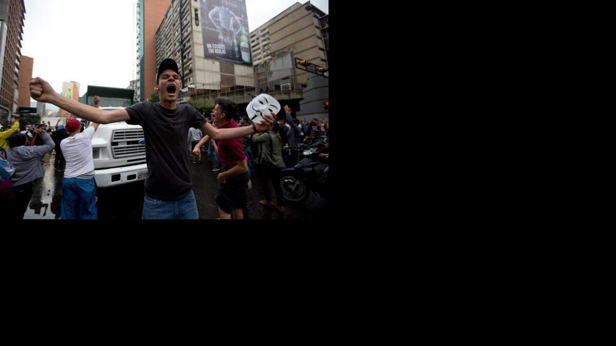 
PROTEST: A demonstrator shouts slogans against Venezuela’s government as protesters block a road in Caracas last week.
