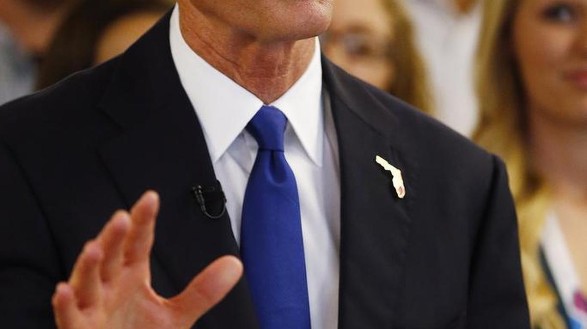 Gov. Rick Scott touted his jobs program during a visit to a cancer research company in Fort Myers earlier this year.