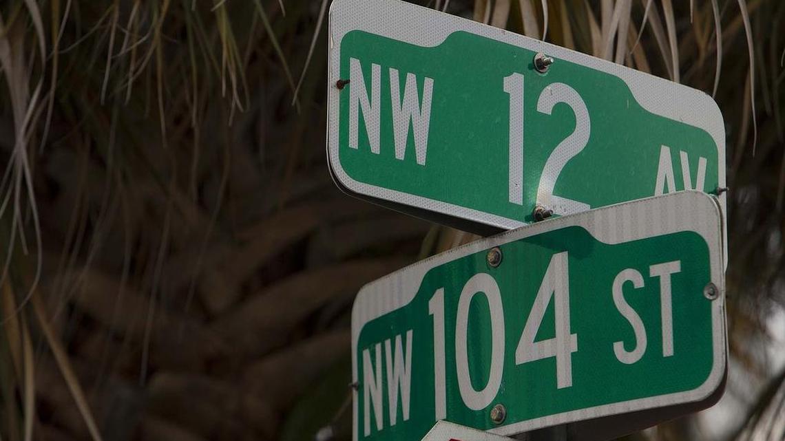Street signs outside the Northwest Miami apartment complex where 6-year-old King Carter was killed.