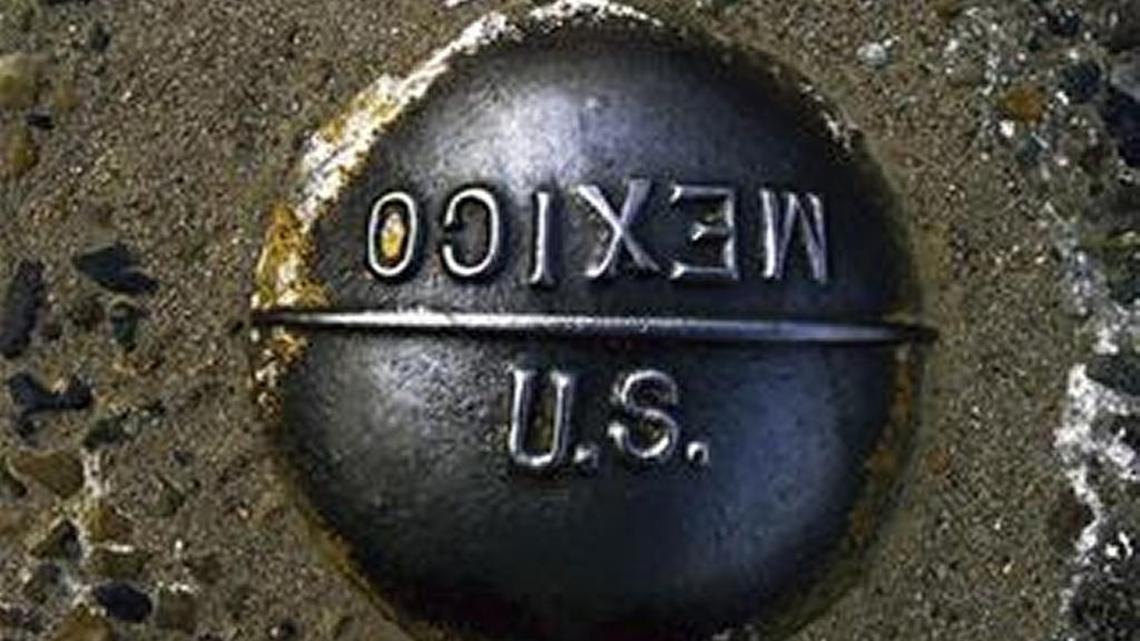 A marker embedded in the pavement marks the imaginary line between the United States and Mexico at the San Ysidro border checkpoint between San Diego, Calif., and Tijuana, Mexico.