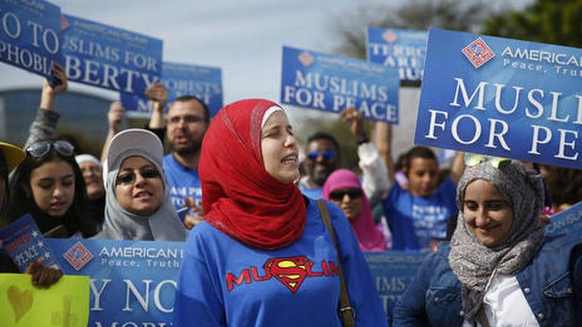 In March, Muslim protesters stand across the street from a Donald Trump rally in Orlando.