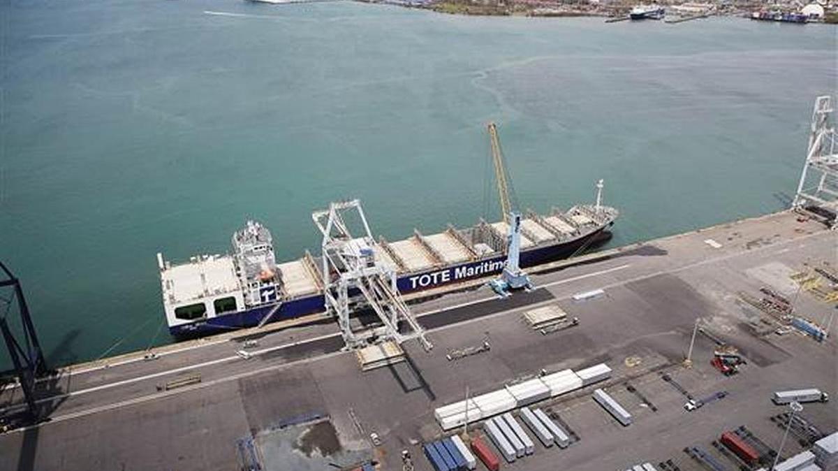 A container ship is seen docked at the port of San Juan as people deal with the aftermath of Hurricane Maria.