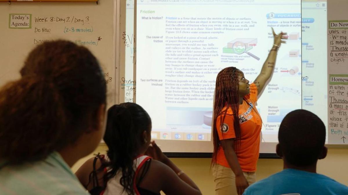 A young teaching fellow makes a point to students in the Breakthrough Miami program.