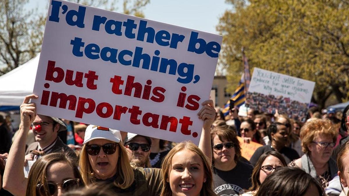 In April, thousands of teachers and supporters marched outside the Oklahoma state Capitol building during the third day of a statewide education walkout for more funding.