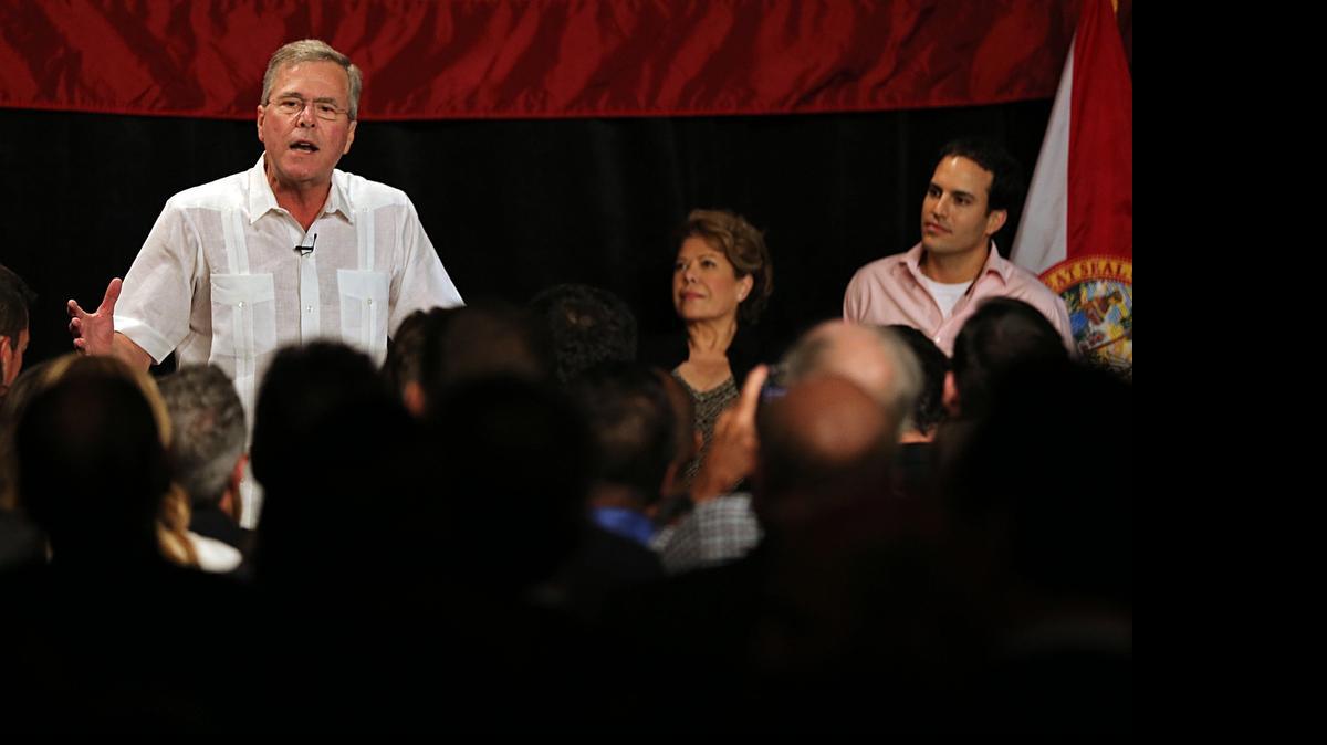 
IN WESTCHESTER: Former Florida Gov. Jeb Bush talks to supporters as his wife and son, Columba Bush and Jeb Bush Jr., listen during a fundraiser in Sweetwater last week.
