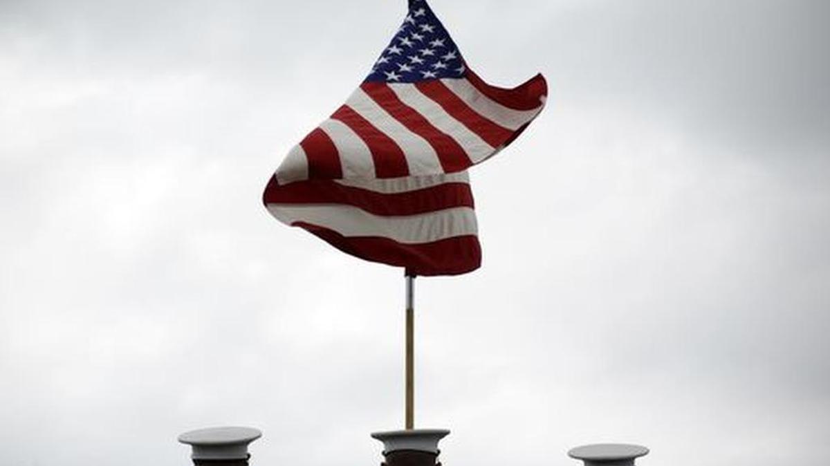 In 2015, the American flag billows and waves on Iwo Jima, now Ioto, during the 70th-anniversary commemoration of one of the bloodiest battles of World War II.