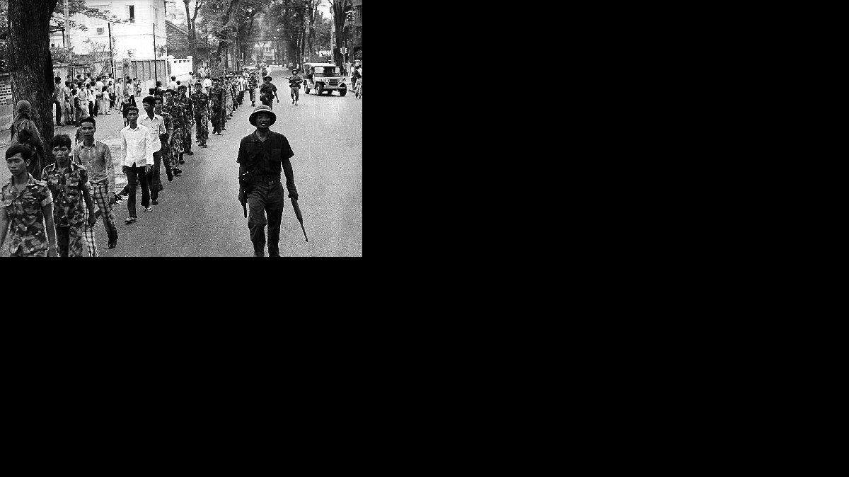 
CAPTURED: Defeated members of the South Vietnamese Army are escorted by Communist soldiers on April 30, 1975.
