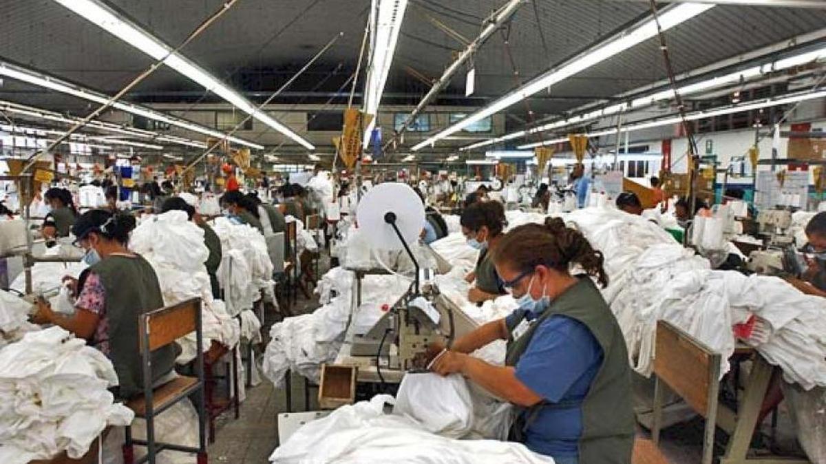 Honduran workers sewing T-shirts. The country is working to improve labor conditions.