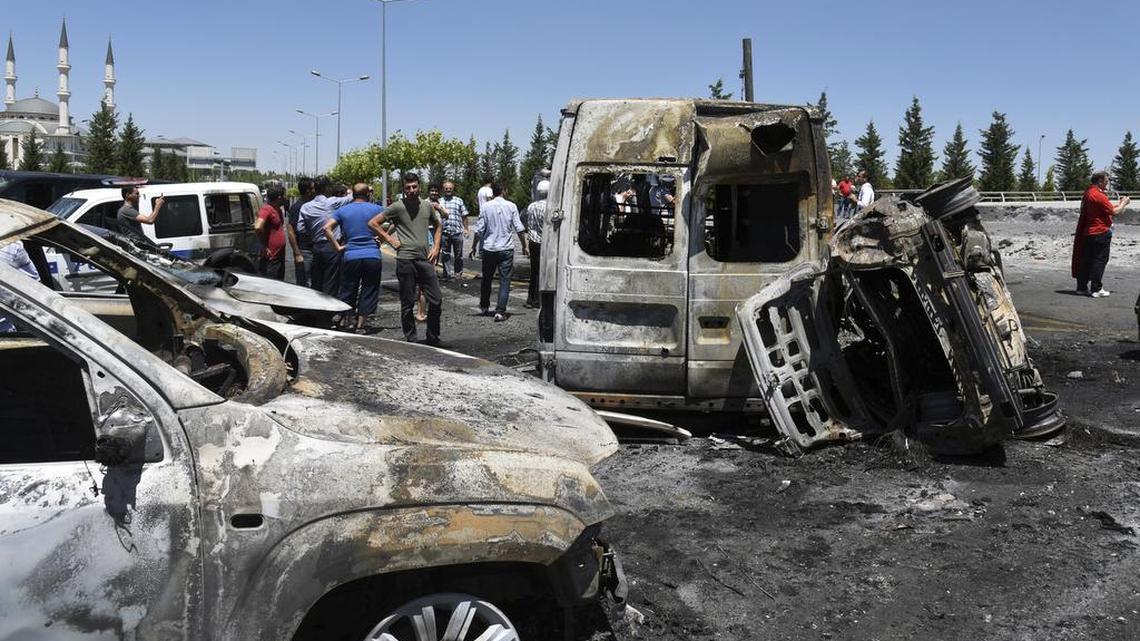 Destroyed cars outside the Presidential Palace in Ankara are evidence of heavy fighting during a recent attempted coup.