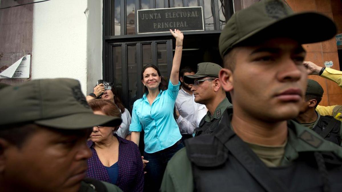 
CARACAS: Opposition leader María Corina Machado leaves the National Electoral Council after she was not allowed to register as a candidate for Congress. 
