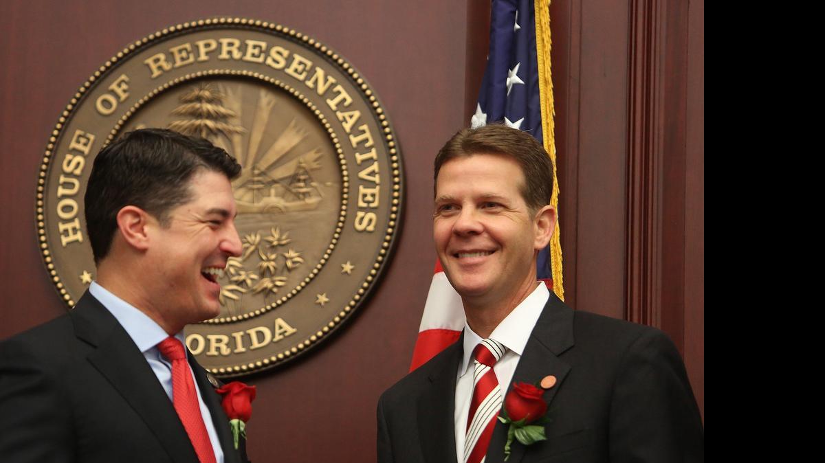 
IN BETTER TIMES: Florida House Speaker Steve Crisafulli, left, and Senate President Andy Gardiner were all smiles when the Legislature convened in March, but the session ended in a dispute over Medicaid..
