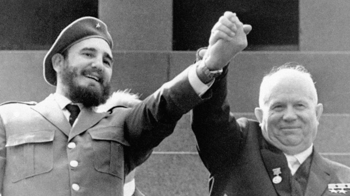Fidel Castro clasps hands with his Soviet benefactor Nikita Khrushchev.