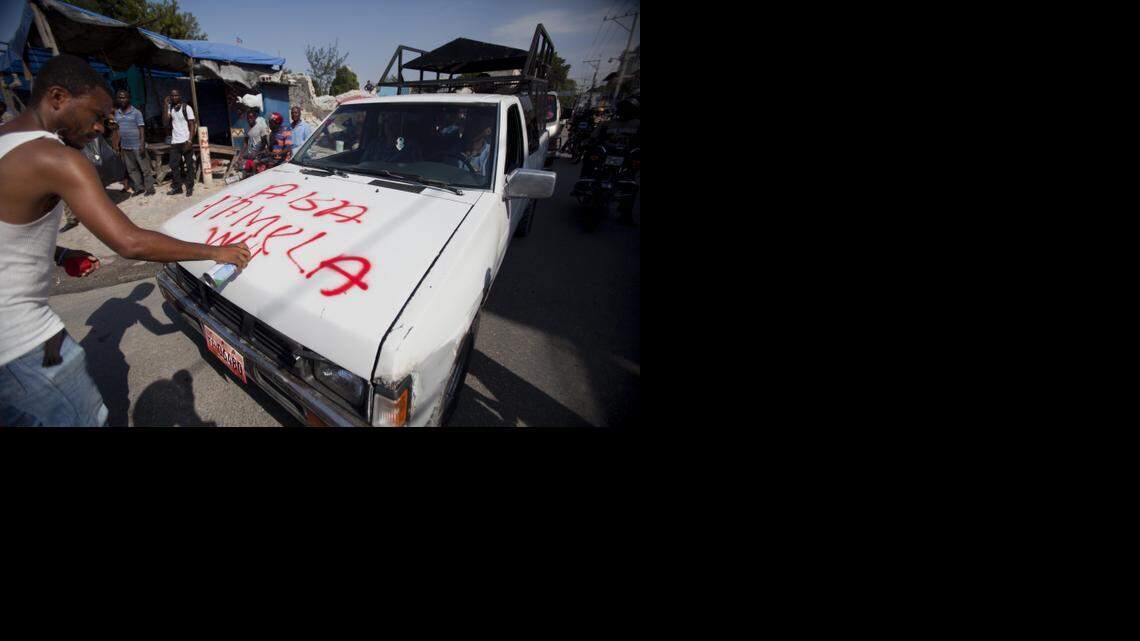 
HAITI TURMOIL: A protester in Port-au-Prince writes in Creole “Down Pamela White,” referring to the U.S. ambassador to Haiti, during a protest against President Michel Martelly last week. 
