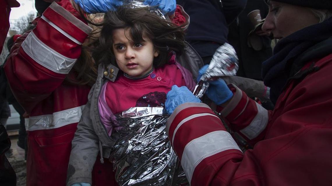 Refugee families and children like this girl arrive on the Greek island of Lesbos after making a perilous crossing across the Mediterranean.
