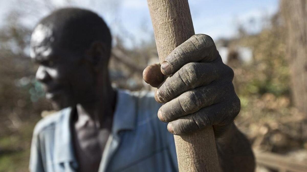 In October, after Hurricane Matthew, Marcorel Nicola was building a tent for shelter outside of Jeremie, Haiti. Nicola lost two children during the storm.