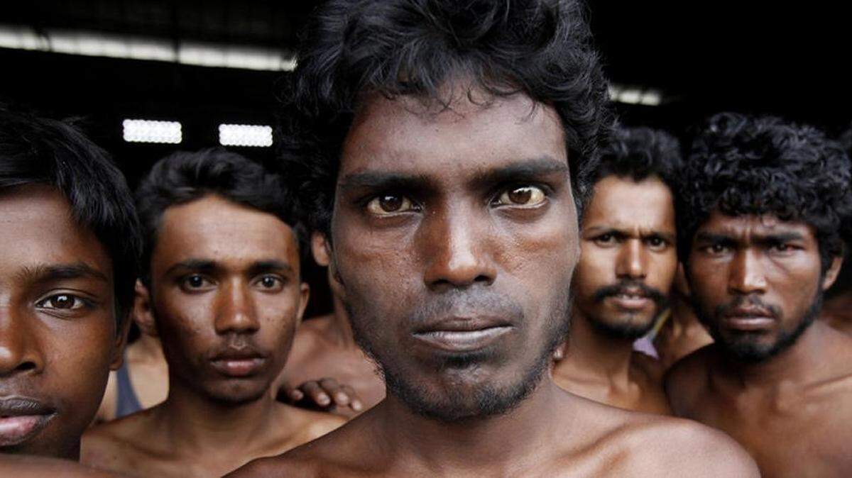 Newly arrived Rohingya migrants from Myanmar gather at Kuala Langsa Port in Indonesia in 2015.