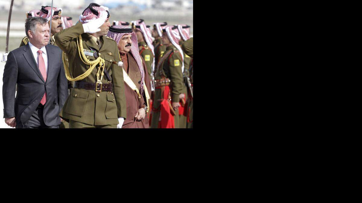 
FIGHTING TERROR: Jordan's King Abdullah II, left, reviews an honor guard with King Hamad bin Issa al-Khalifa of Bahrain. Both countries are part of the U.S.-led coalition against the Islamic State.
