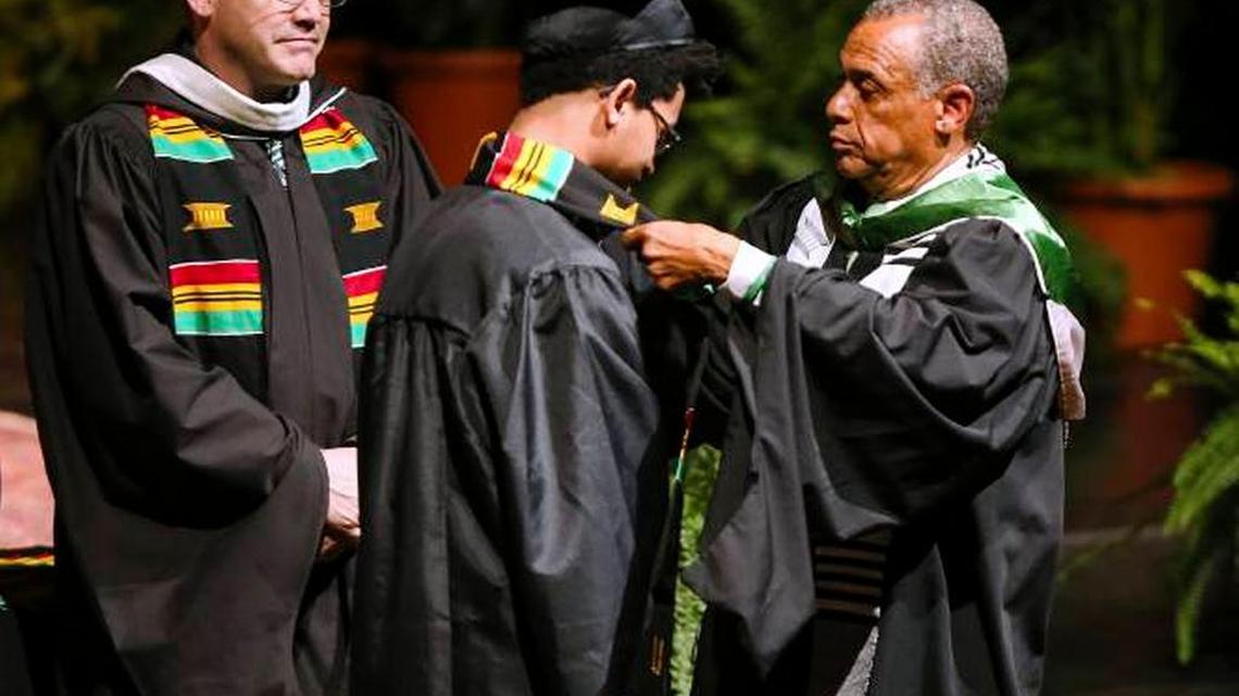 Back in April 27th, Maurice Cooley, right, Associate Vice President of Intercultural Affairs at Marshall University, presents Demetrius Miller with his Kente cloth during Marshall's spring Donning of the Kente ceremony in Huntington, W. Va. Harvard will join a growing number of universities when it holds its first “Black Commencement” on Tuesday.