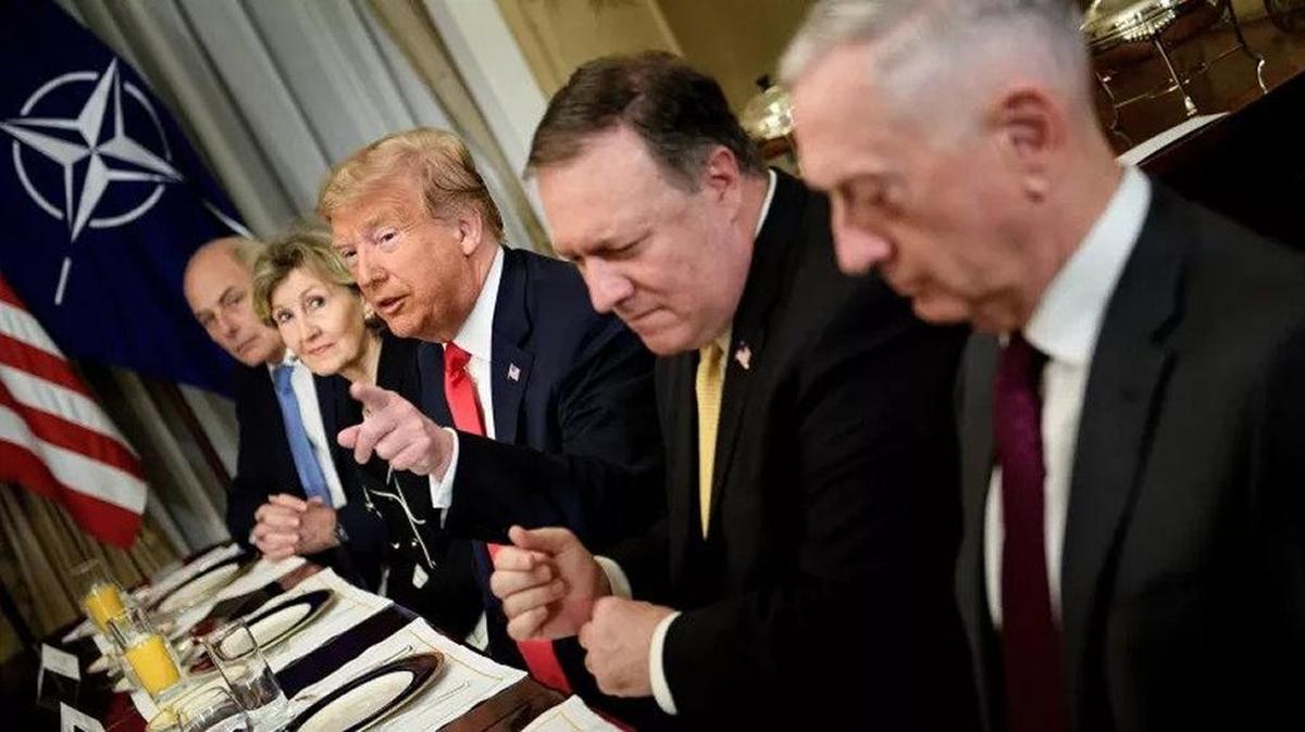 White House Chief Of Staff John Kelly, U.S. Ambassador to NATO Kay Bailey Hutchison, U.S. Secretary Of State Mike Pompeo and U.S. Secretary Of Defense James Mattis flank President Trump at a NATO breakfast meeting.