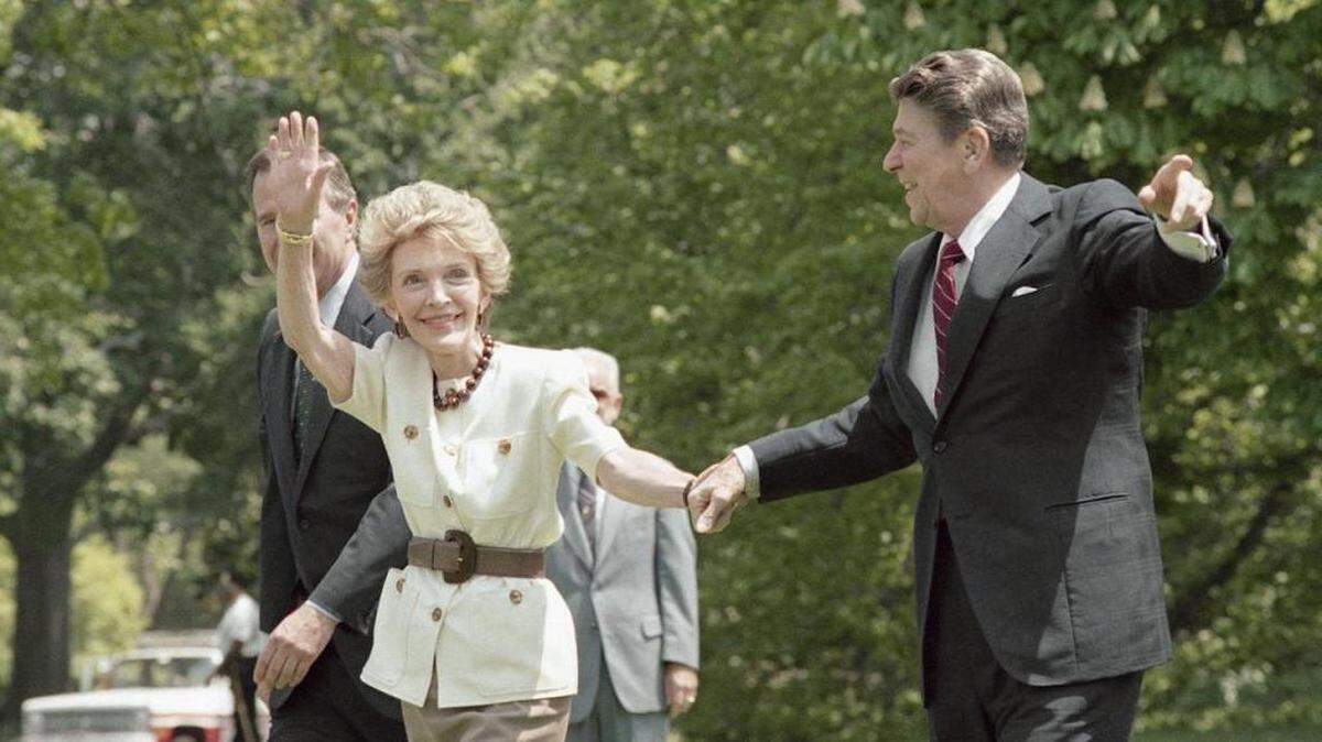 First lady Nancy Reagan waves after she and the president leave the Marine One helicopter on the South Lawn of the White House in 1986.