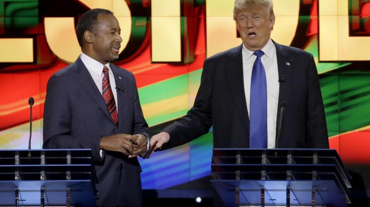 Former presidential candidate Ben Carson, left, is scheduled to throw his support to Donald Trump Friday.