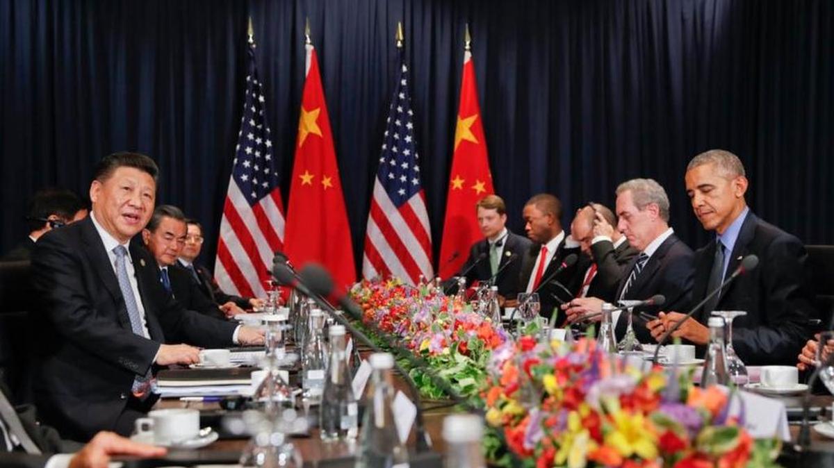 China’s President Xi Jingping, left, speaks during a meeting with President Obama, right, at the Asia-Pacific Economic Cooperation in Lima, Peru.
