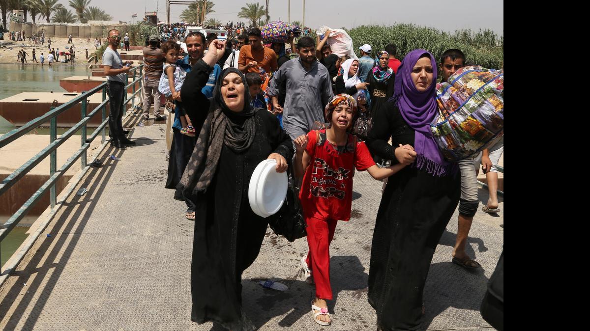 
IN FLIGHT: Thousands of displaced Iraqis are fleeing the violence in Ramadi following its capture by ISIS forces.
